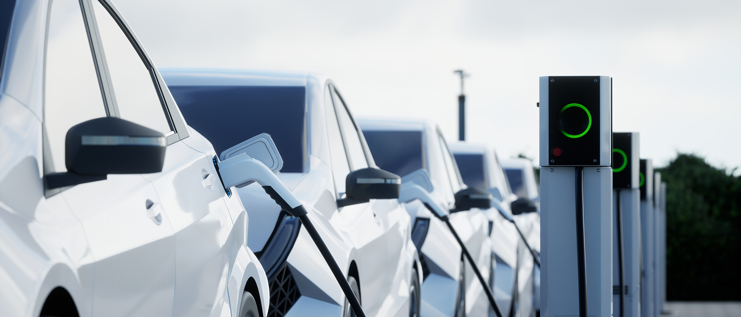 Electric vehicle charging at a station